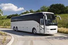 image of a large white charter bus 